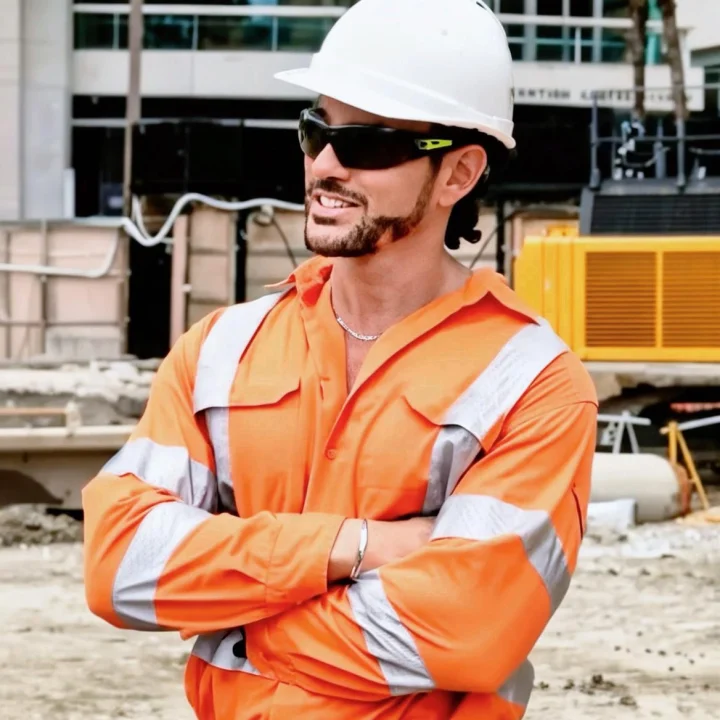 Male construction worker in orange high-visibility vest